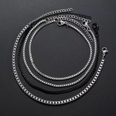 Conjunto de pulseiras masculinas modelo Belluno com correntes venezianas prateadas e pretas.